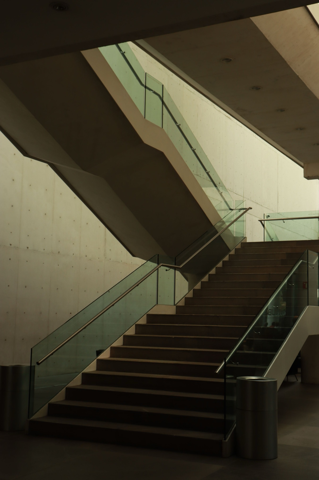 Architectural stair with stainless handrail and glass balustrade