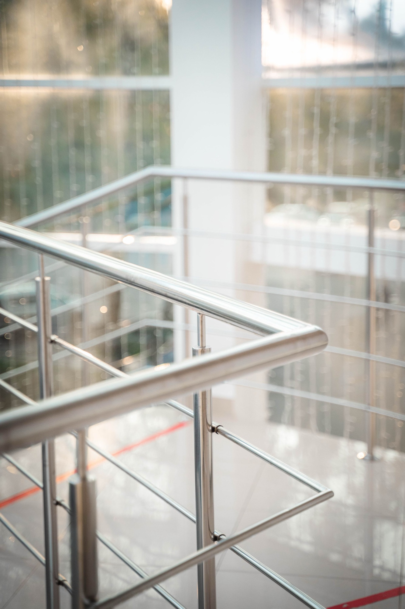 Close-up of stainless steel stair railings and posts